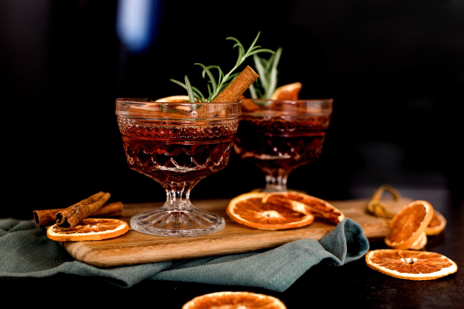 Cocktail Drinks with Cinnamon, Oranges, and Herbs