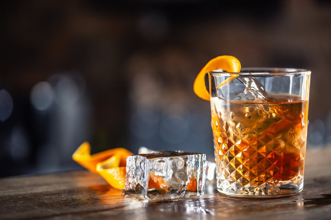 Old Fashioned Rum Drink on Ice with Orange Zest Garnish